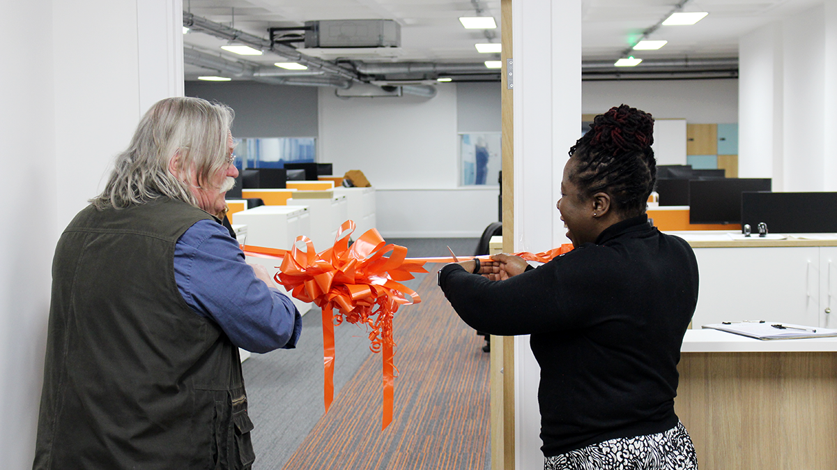 Paulette Hamilton and Andy Burkitt cut the ribbon