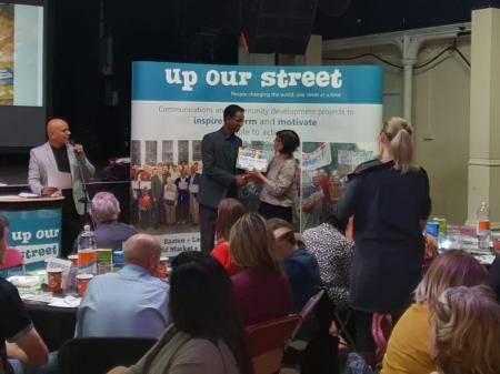 Khalid Ahmed receiving award at the Up Our Street Thank You Awards 2018