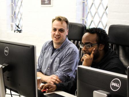 Steve and Rashiid on a computer