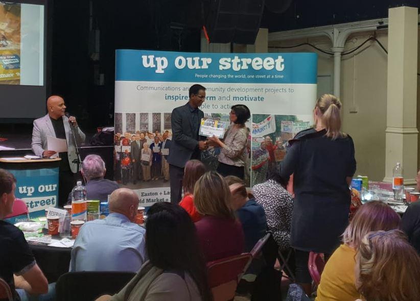 Khalid Ahmed receiving award at the Up Our Street Thank You Awards 2018