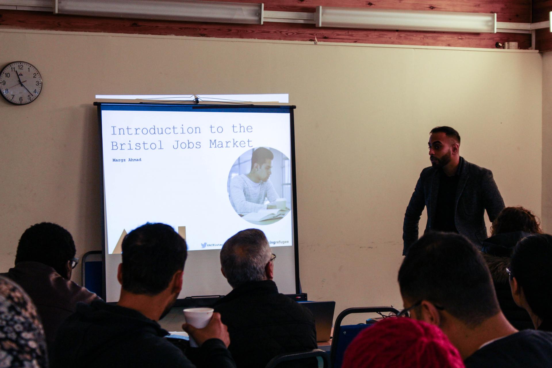 Marghoob Ahmad presents at the Bristol workshop for asylum seekers