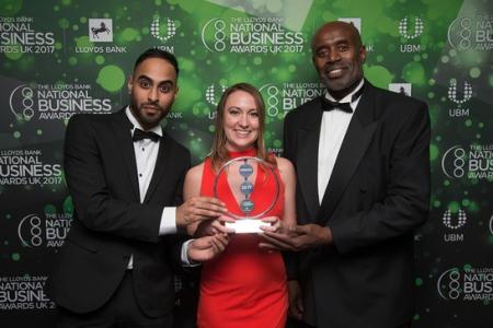 ACH team holding an award at South West Business in Bristol